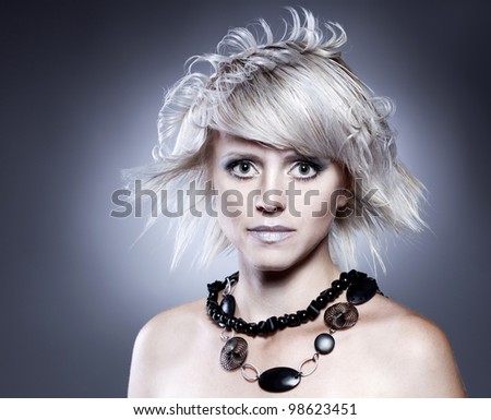 Beautiful woman with stylish hairstyle with jewelry