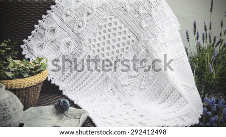 Crochet, Cable Knit Afghan Baby Blanket in White on Sofa with Lavender,  closeup Soft Focus High Contrast Desaturated Grunge Filtered