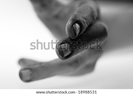 Hand reaching for help, special close up focused on cracked fingers with grunge texture signifying frustration and powerlessness