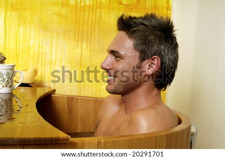 Young man in a hot bath