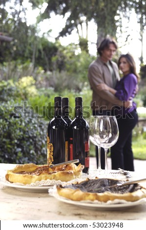 Adult couple in a country farm with wine