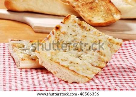 mozzarella cheese garlic bread on napkin