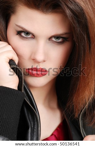 headshot brunette woman with leather jacket