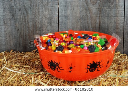 bowl of Halloween candy on straw