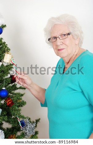 Senior woman stealing candy cane