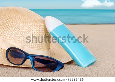 suntan lotion hat focus on sun glasses