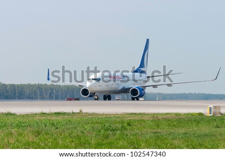 RUSSIA, DOMODEDOVO - 01 SEPTEMBER 2011: Boeing B737 aircraft operated by AnadoluJet is taxiing airport Domodedovo on September 01, 2011. The airline was founded on 23 April 2008 as a low-cost.