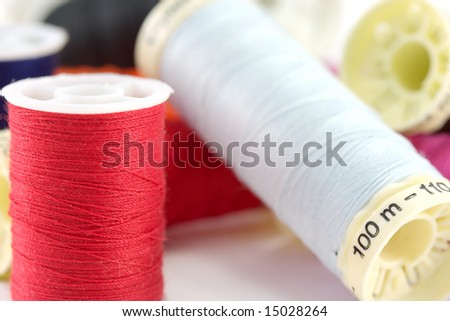 A close-up of various colored cotton reels.