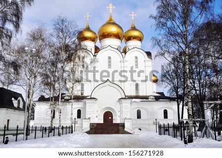 The Uspensky Cathedral in Yaroslavl, Russia in Winter - golden domes and crosses.  It is one of the Golden Ring cities, it\'s historical part is a UNESCO World Heritage Site