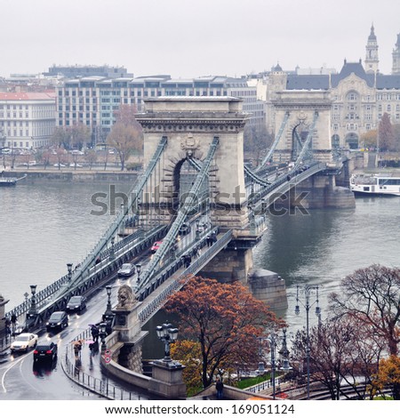 Chain bridge in Budapest, Hungary in early Winter. It is a suspension bridge that spans the River Danube between Buda and Pest. It has decorations made of cast iron and is considered high in Europe
