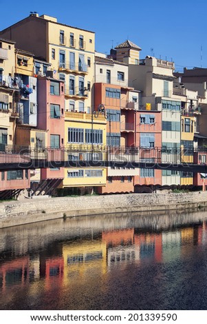 Picturesque painted houses overlooking the river Onya of an old mediterranean city Girona in Catalonia, Spain. It is a popular touristic destination