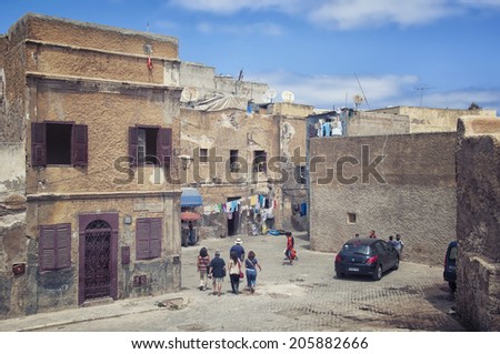 EL JADIDA, MOROCCO - AUGUST 18, 2011: Inside the portuguese fortified city of Mazagan. It is a port city on the Atlantic coast famous touristic destination. Tourists walking around the town