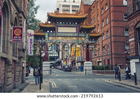 MANCHESTER, UK - SEPTEMBER 3, 2014: Archway on Faulkner Street at Chinatown - an ethnic enclave in the city center. First settlers arrived in early 20th century. Now it has many restaurants and bars.
