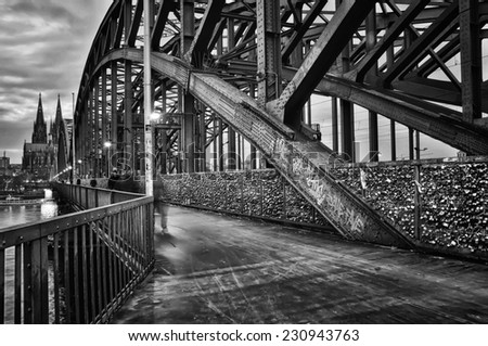 Night view of Hohenzollern Bridge over the river Rhine in Cologne. It is a most heavily used railway bridge in Germany accessible for pedestrians