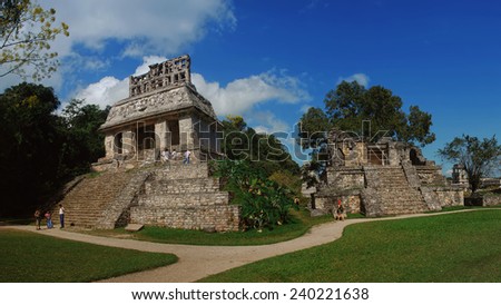 PALENQUE, MEXICO - MARCH 20, 2011: People at mayan ruins with Palace and observatory. It is one of the best preserved sites, which contains interesting architecture and is popular tourist attraction