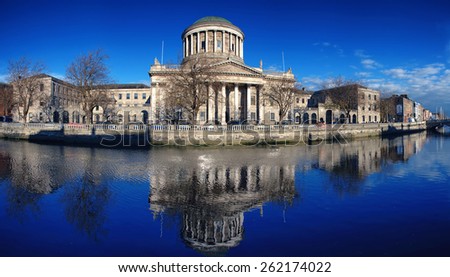 Four courts building in Dublin, Ireland with river Liffey