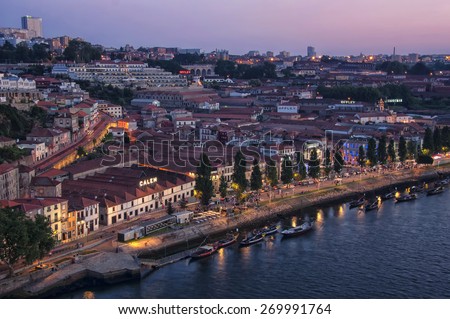 PORTO, PORTUGAL - JULY 21, 2013: Aerial view of wine yards at night in the city of Gaia. It is famous for Port Wine cellars and nightlife
