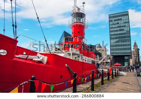 LIVERPOOL, UK - SEPTEMBER 5, 2014: Unidentified people in Red Ship at the Albert Dock - buildings and warehouses opened in 1846, part UNESCO designated World Heritage Maritime Mercantile City.
