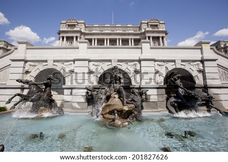 WASHINGTON D.C. - MAY 23, 1014: The Court of Neptune Fountain is a group of bronze sculptures, by Roland Hinton Perry in 1897-1898. They are located at the Library of Congress , in Washington, D.C.