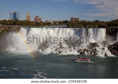 NIAGARA FALLS, CANADA - OCTOBER 12, 2014: The famous Falls boat tour experience is North America\'s oldest attraction, and has drawn millions of visitors since 1846.