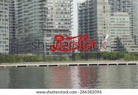 NEW YORK - May 28, 2015: Constructed in 1936 by Artkraft Strauss, the 120-foot  long and 60-foot  high neon Pepsi-Cola sign sits within Gantry State Plaza Park.