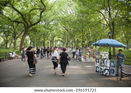 NEW YORK - May 25, 2015: People walking in Literary Walk, in Central Park, New York City. Central Park is an urban park in the central part of the borough of Manhattan with a  size of 843 acres.
