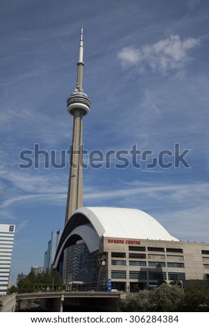 TORONTO - AUGUST 6, 2015: The Rogers Center and the CN Tower are key architectural features that figure prominently in Torontos cityscape.