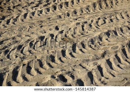 traces of the machine on the surface  ground soil texture background