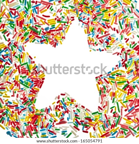 Border frame star of colorful sprinkles top view close up isolated on white background card for text