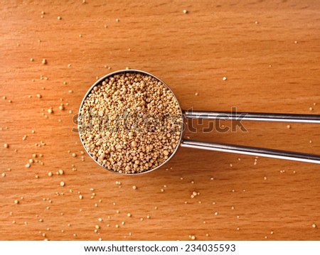 dry yeast on table surface top view close up background