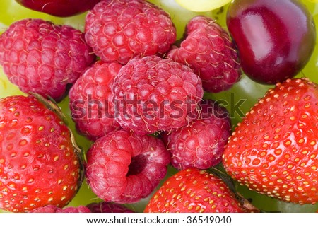 fresh fruits and berries fruits heap pile close up isolated on white background