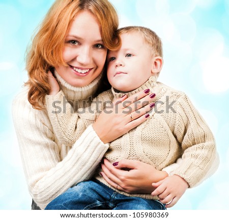 Woman and son on blue