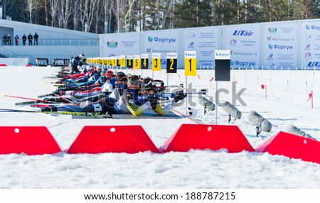 Tyumen,RUSSIA - APR 9,2014:Martin Fourcade (FRA) and other on a firing line at Biathlon  Men\'s Mega Mass start at International Biathlon Competition \