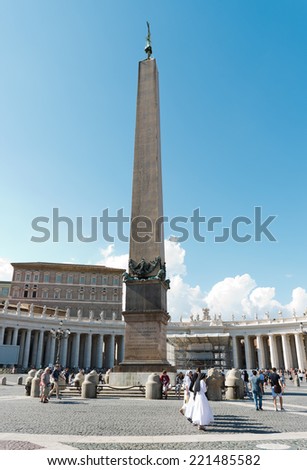 VATICAN CITY, VATICAN - JULY 15 2014: Tourists at Saint Peter\'s Square in Vatican City, Vatican. Saint Peter\'s Square is among most popular pilgrimage sites for Roman Catholics.