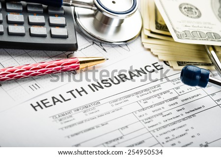 Health care costs. Stethoscope and calculator symbol for health care costs or medical insurance