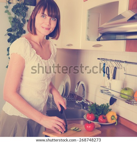home life: woman preparing something to eat. Instagram style filtred image