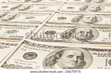 American Money in 100 bills piled high and waiting to be picked up