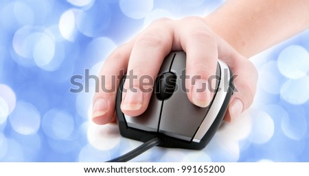 computer mouse with hand  with blue lights in the background