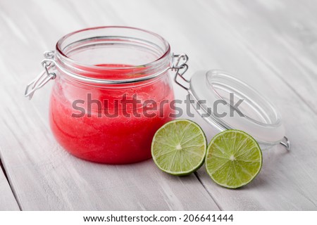 Handmade DIY natural sugar and salt body scrub with fresh lime, almond and coconut oil