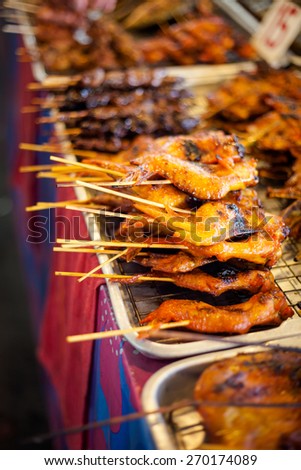 Fresh made chicken wing satay skewer. Traditional thai cuisine on market.