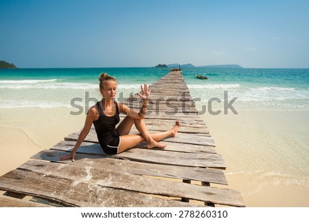 Summer yoga session on a beach - tropical Koh Rong island, Cambodia