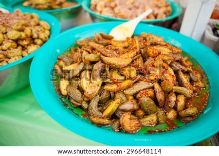 Selection of asian pickles prepared with chilli. Traditional thai cuisine on market.