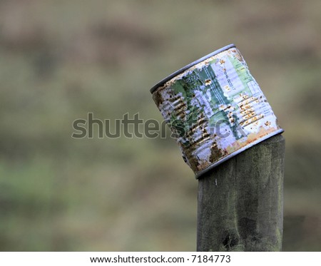 Old tin can on a post.
