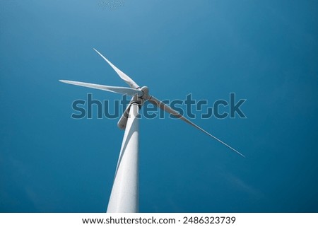 Image, Stock Photo Wind turbine against a blue sky with sun and clouds, Rhineland-Palatinate, Germany. alternative energy, new natural landscape