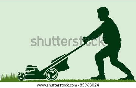 Man cutting grass with lawn mover