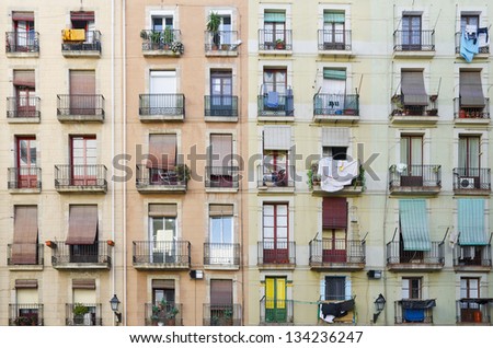 Old facade house. Old style windows with balcony, detail of some windows and balcony. Barcelona. Spain