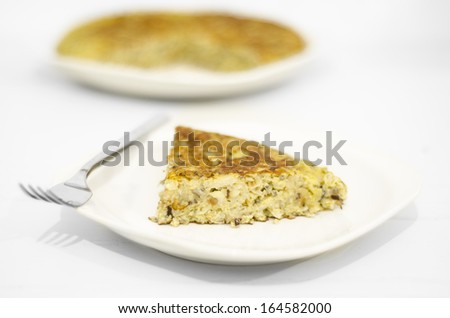 Fresh homemade Spanish tortilla (Omelet typical of Spanish cuisine with potatoes and onions). Selective Focus