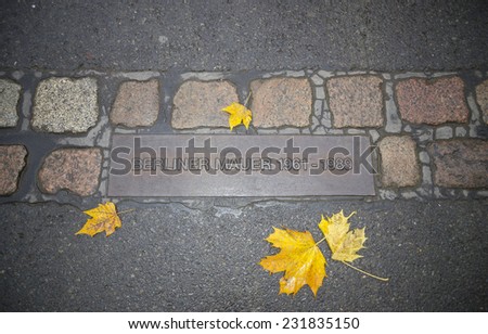 Berlin wall sign on the road. Traveling in autumn