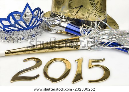 New Years party supplies to ring in the year 2015 on a white background