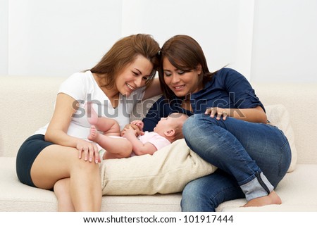 Two women\'s gambling with a baby